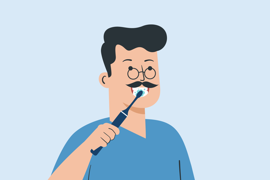 how should you hold the toothbrush during brushing