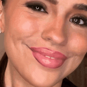 Woman smiling after rinsing